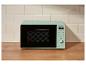 Micro-ondes vert menthe avec affichage numérique et commandes dans une cuisine moderne.