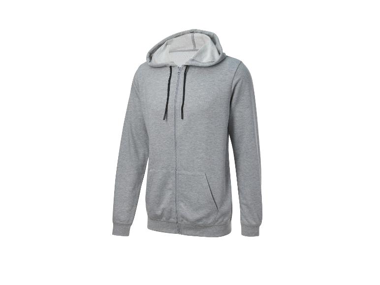 Un sweat-shirt gris à capuche et fermeture éclair