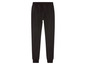 Pantalon de survêtement noir avec ceinture élastique.