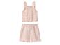Ensemble bébé tricoté rose à volants: haut et short avec motif ajouré.