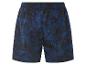 Shorts de bain bleu marine à motif tropical.