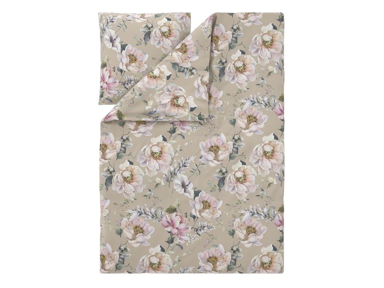 Parure de lit florale avec un fond beige et de grandes fleurs roses et blanches.