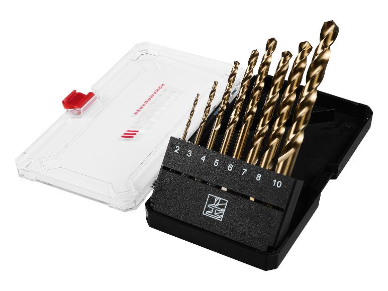 Ensemble de forets dorés dans un étui noir avec couvercle transparent.