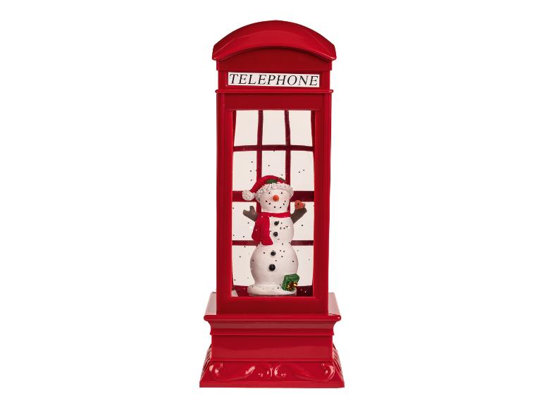 Cabine téléphonique rouge avec un bonhomme de neige à l'intérieur, sur fond blanc