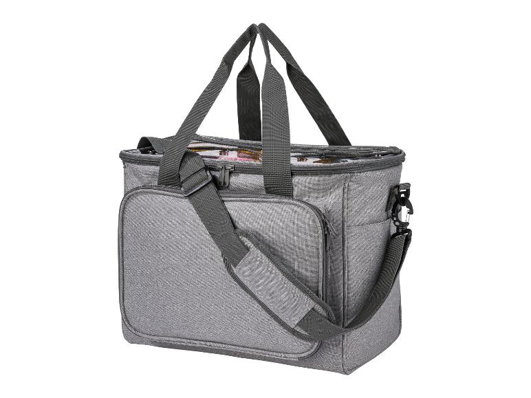 Un sac isotherme gris avec des poignées et une bandoulière.