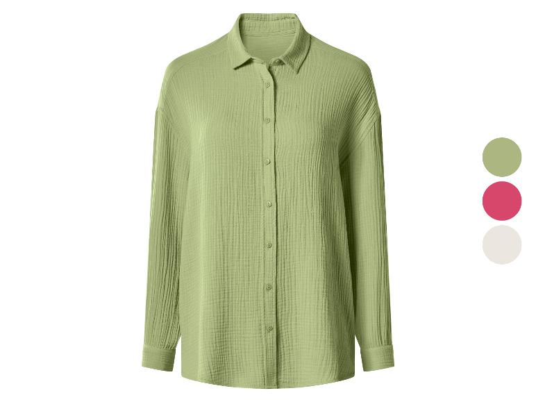 Chemise femme vert clair à manches longues avec boutons et col.