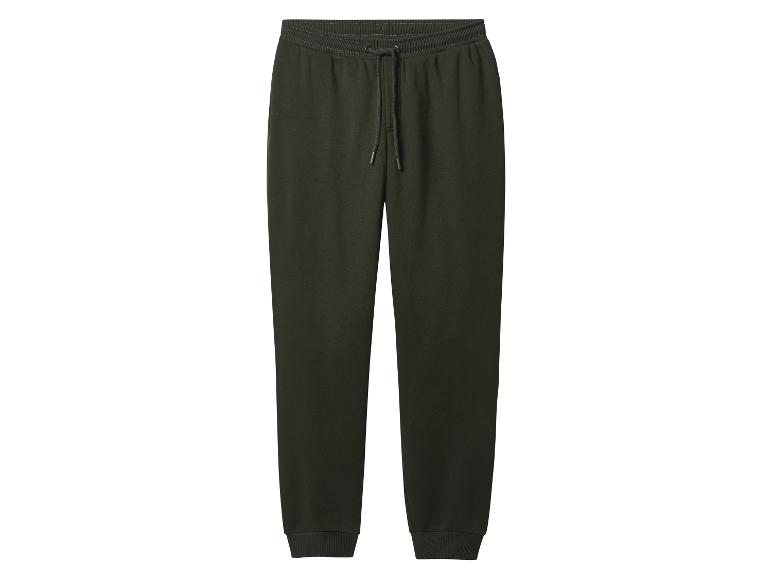 Pantalon de jogging vert foncé avec cordon de serrage à la taille et poignets côtelés.