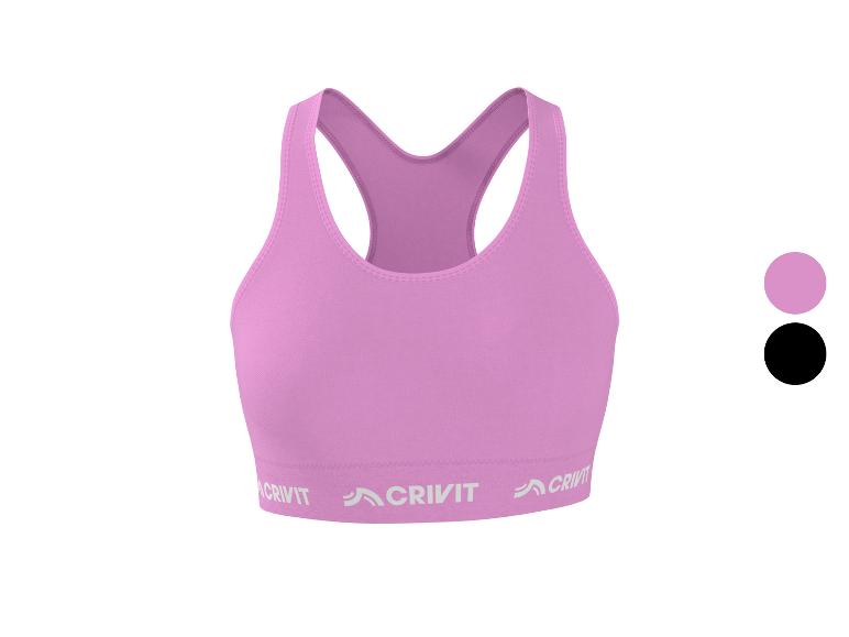 Soutien-gorge de sport rose avec lettrage sur la bande, également disponible en noir.