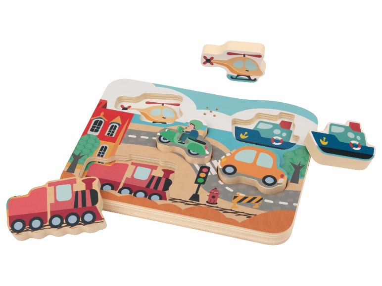 Puzzle en bois avec des moyens de transport: train, voiture, bateau, hélicoptère et moto.
