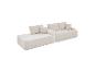 Canapé modulaire en velours côtelé beige avec coussins, idéal pour un salon.
