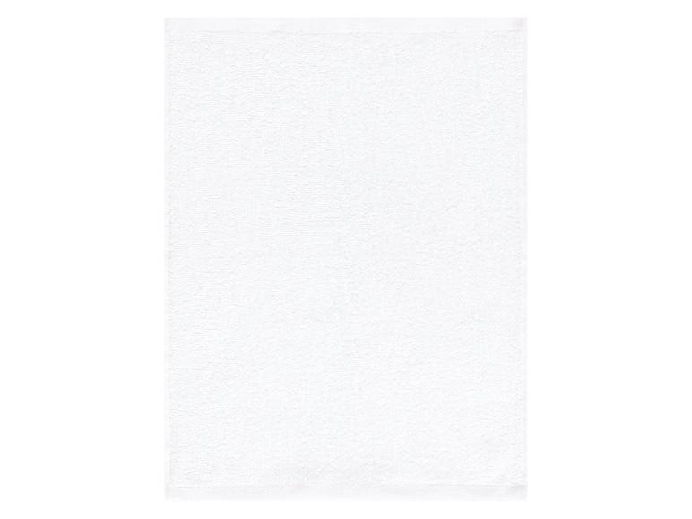 Serviette de bain blanche, tissu éponge.