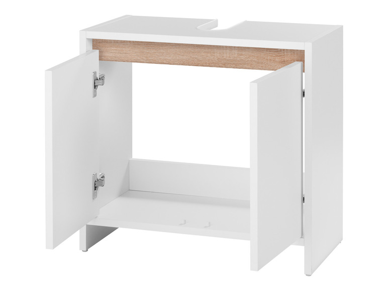 Une armoire de salle de bain blanche avec les portes ouvertes.
