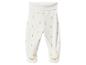 Pantalon de bébé blanc avec motif de canetons et visage de canard sur les pieds