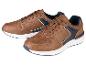 Chaussures de sport marron pour homme avec des détails bleus.