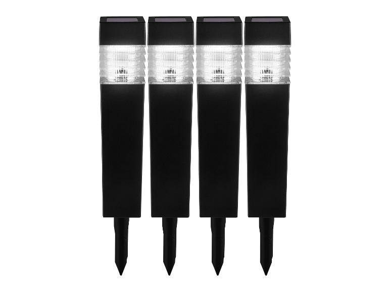 Trois lampes solaires de jardin noires avec des ampoules LED