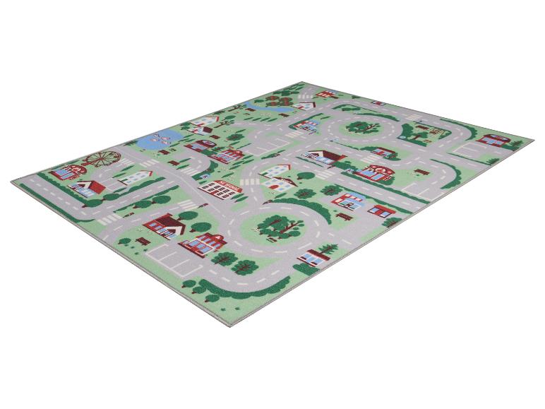 Tapis de jeu pour enfants avec routes, maisons et paysage urbain.