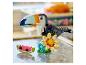 Lego Creator toucan, fleur et tranche de pastèque sur une table