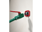 Poteau de support télescopique vert et rouge touchant un mur.