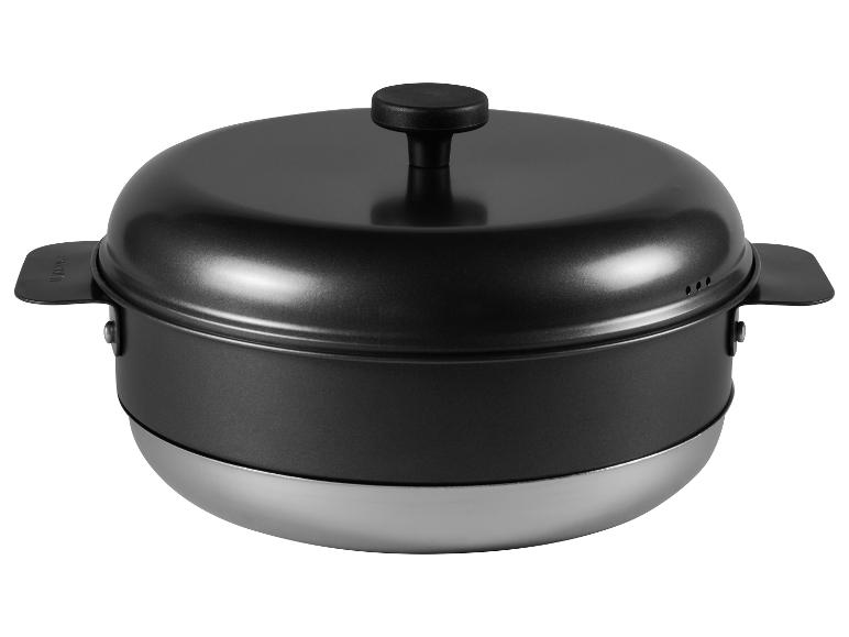 Cuit-vapeur noir avec base métallique et poignées.