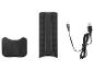Support de téléphone portable noir avec câble de chargement USB-C et accessoire.