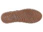 La semelle d'une chaussure de sport marron avec un motif en grille.