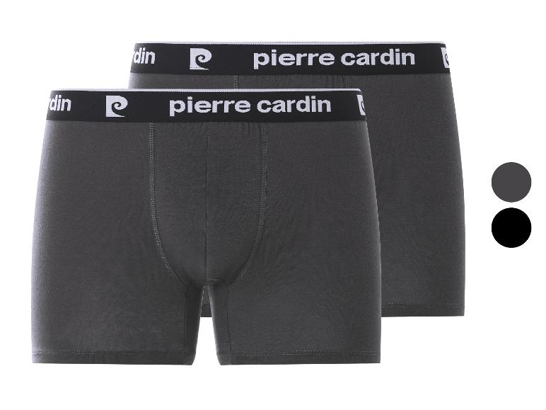 Deux paires de boxers gris foncé pour hommes avec une ceinture noire et blanche de marque.