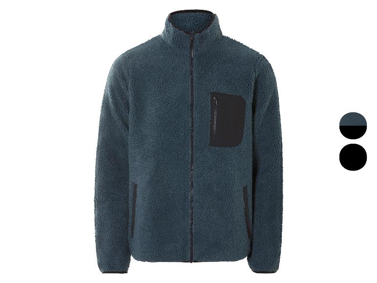 Une veste en polaire bleu foncé avec une fermeture éclair.