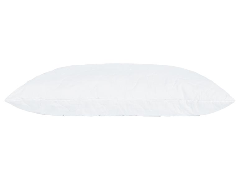 Oreiller blanc matelassé.