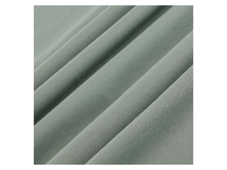 Gros plan sur un tissu de couleur vert clair.