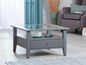 Table basse grise avec plateau en verre et tiroir.