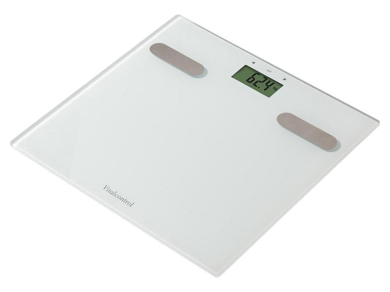 Pèse-personne numérique blanc affichant 62,4 kg