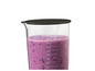 Un bol de mixeur avec un smoothie aux baies.