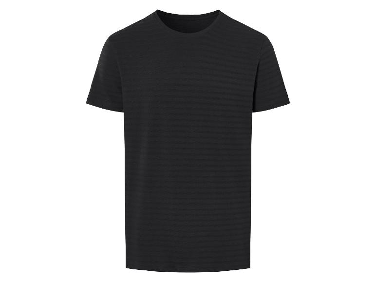 T-shirt noir à rayures fines, style minimaliste.