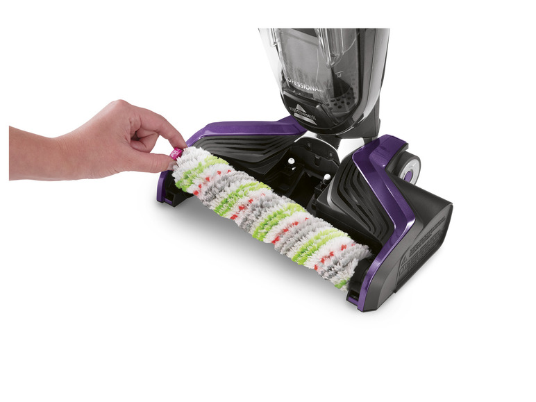 Un nettoyeur vapeur violet et noir avec une brosse rotative.