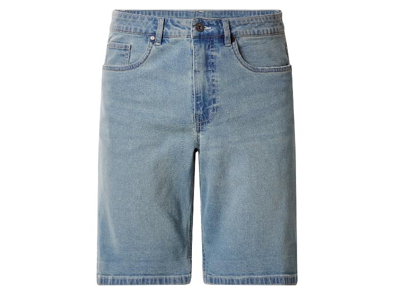Short en jean bleu à coupe large avec poches et fermeture boutonnée.