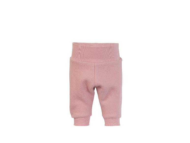 Pantalon de bébé rose en laine avec taille haute et bords côtelés.