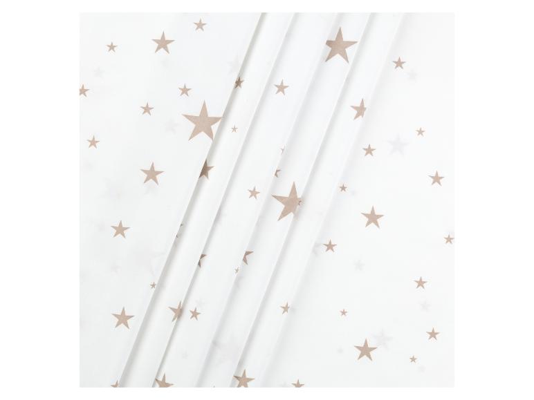 Tissu blanc avec des étoiles dorées