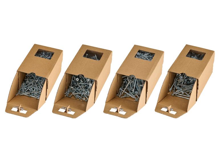 Quatre boîtes en carton avec des vis métalliques et un embout de tournevis.