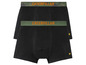 Deux boxers noirs Caterpillar avec un motif camouflage et une bande verte.