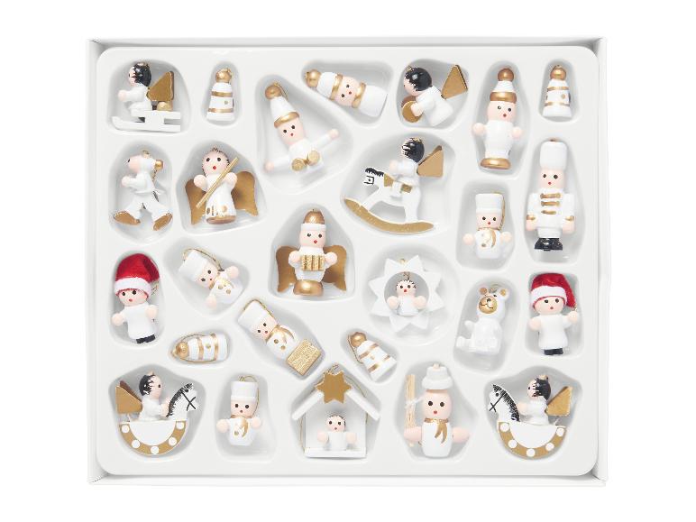 Ensemble d'ornements de Noël miniatures blancs et dorés dans une boîte.