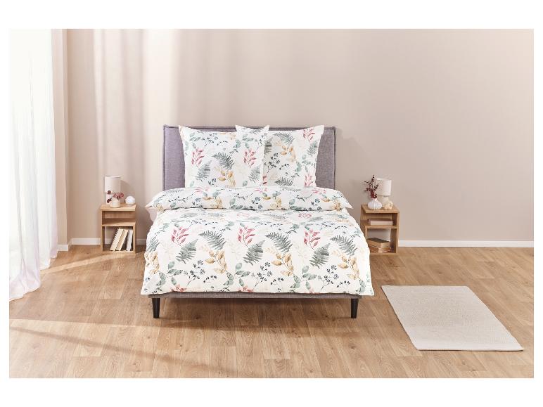 Parure de lit avec un motif botanique de feuilles.