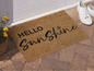 Un paillasson avec l'inscription 'Hello Sunshine'