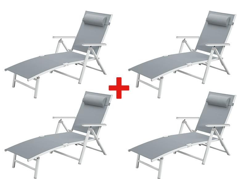 Quatre chaises longues grises avec appuie-tête.