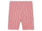 Short cycliste rose à motif feuillage.