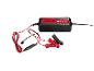 Un chargeur de batterie Ultimate Speed noir avec des pinces et des câbles rouges.
