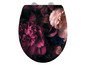 Un abattant de toilettes avec un motif floral de fleurs roses et violettes