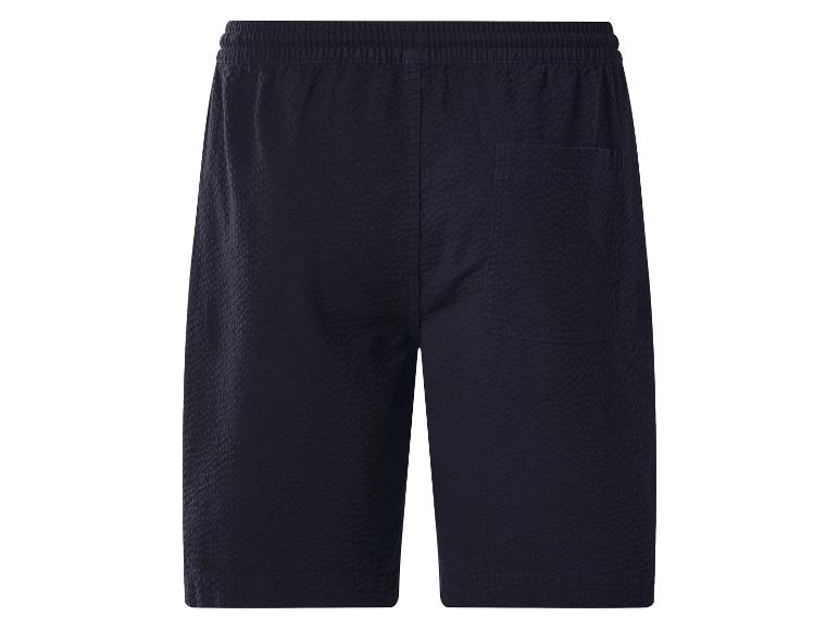 Shorts bleu foncé avec taille élastique et poche arrière.