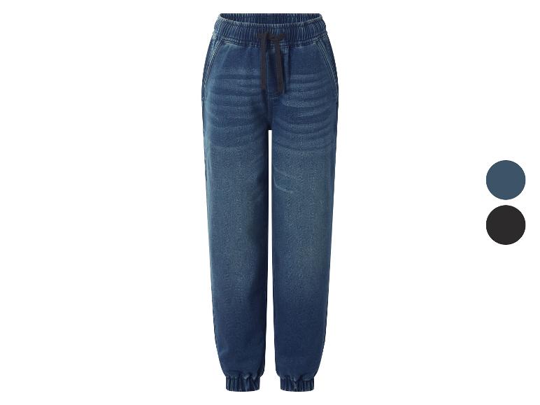 Jean jogger enfant bleu avec taille élastique et cordon de serrage.