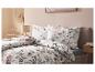 Drap-housse en jersey LIVARNO home sur un lit avec parure de lit florale