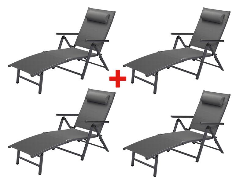 Quatre chaises longues pliantes grises avec appuie-tête.